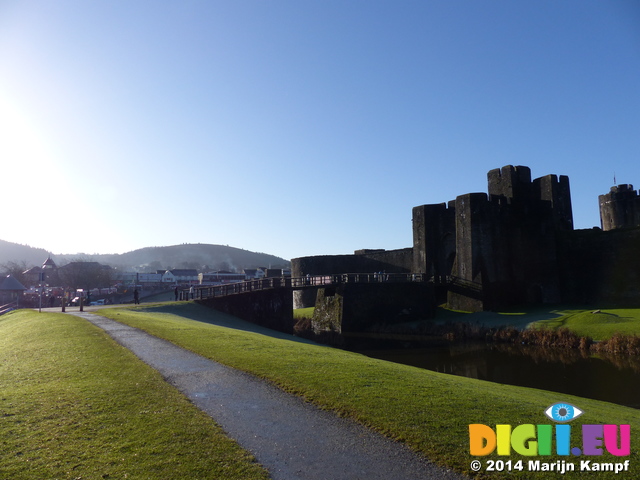 FZ010852 Smoke from chimneys at houses by Caerphilly castle